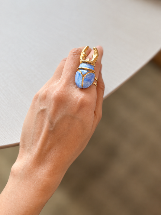Ira iridescent handmade porcelain ring with blue porcelain centerpiece